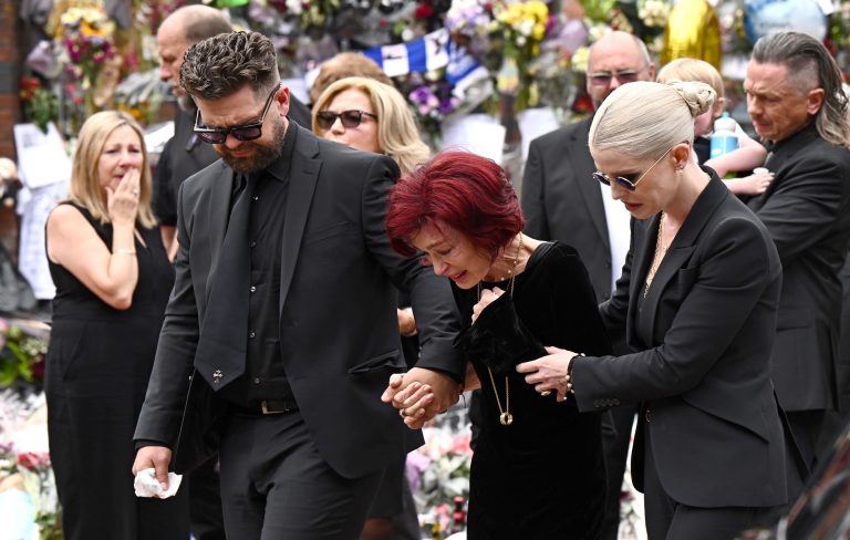 thousands gather with emotional family as rock icon laid to rest in Birmingham